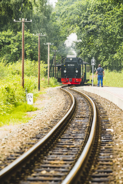 Rugen Island, Baltic coast, Mecklenburg-Western Pomerania, Germany. The historical Rugensche Baderbahn steam train called 