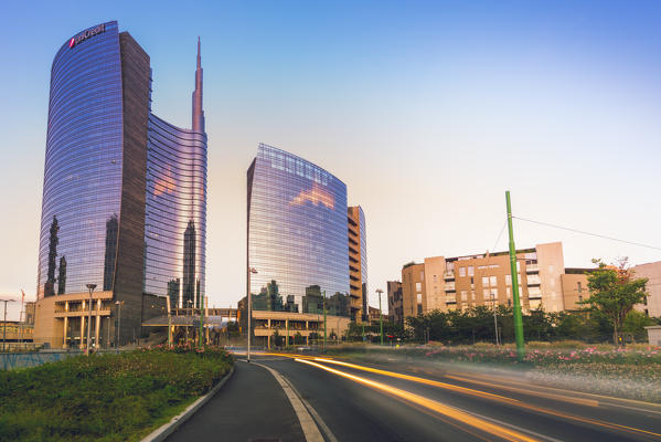 Milan, Lombardy, Italy. Light trails in Porta Nuova district at dusk.