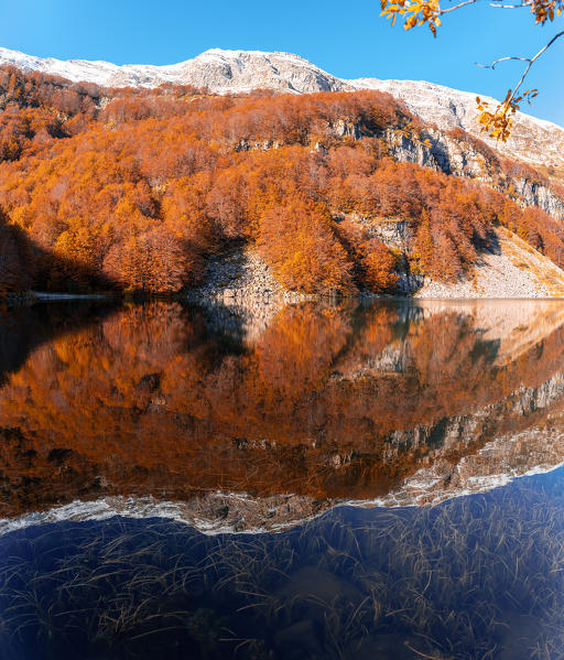 Lago Santo Modenese, reflections and autumn color leaves. Emilia Romagna, Italy