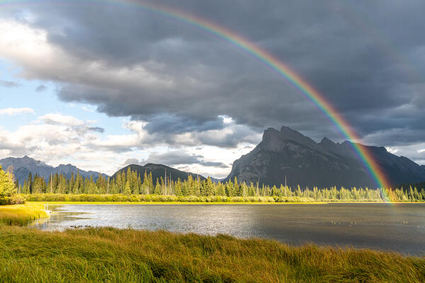 Mount Rundle and Vermillion Lakes, Banff-Jasper National Parks, Alberta, Canada. Cloudy sky with rainbow