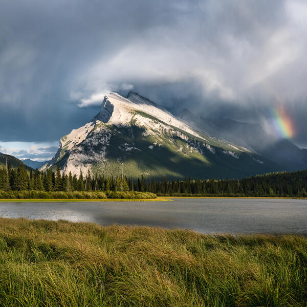 Mount Rundle and Vermillion Lakes, Banff-Jasper National Parks, Alberta, Canada. Cloudy sky with rainbow