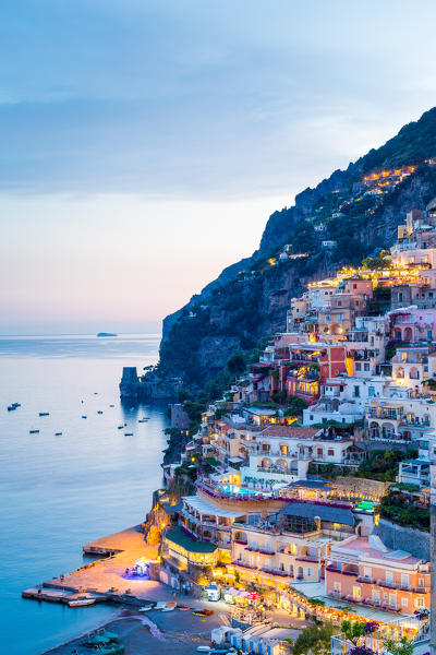 Positano, Amalfi Coast, Campania, Sorrento, Italy. View of the town and the seaside in a summer sunset