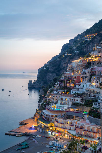 Positano, Amalfi Coast, Campania, Sorrento, Italy. View of the town and the seaside in a summer sunset