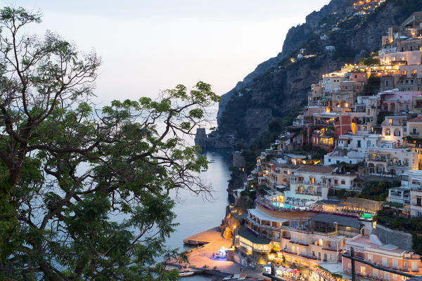 Positano, Amalfi Coast, Campania, Sorrento, Italy. View of the town and the seaside in a summer sunset
