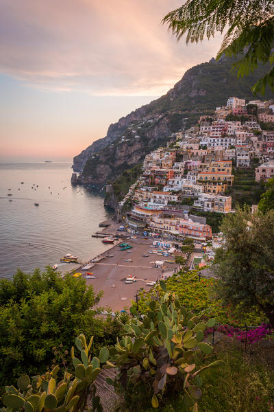 Positano, Amalfi Coast, Campania, Sorrento, Italy. View of the town and the seaside in a summer sunset