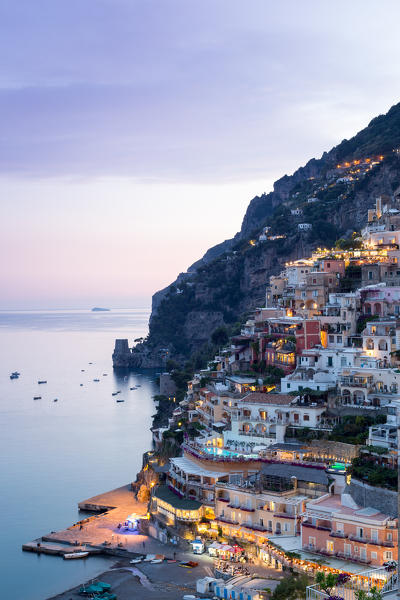 Positano, Amalfi Coast, Campania, Sorrento, Italy. View of the town and the seaside in a summer sunset