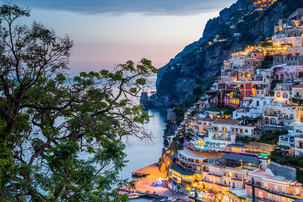 Positano, Amalfi Coast, Campania, Sorrento, Italy. View of the town and the seaside in a summer sunset
