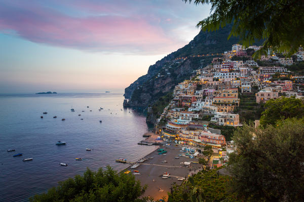 Positano, Amalfi Coast, Campania, Sorrento, Italy. View of the town and the seaside in a summer sunset