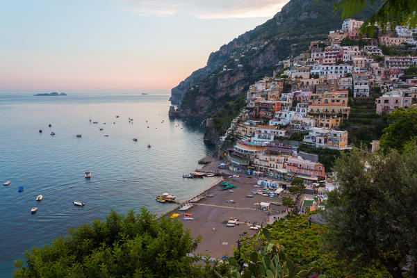 Positano, Amalfi Coast, Campania, Sorrento, Italy. View of the town and the seaside in a summer sunset