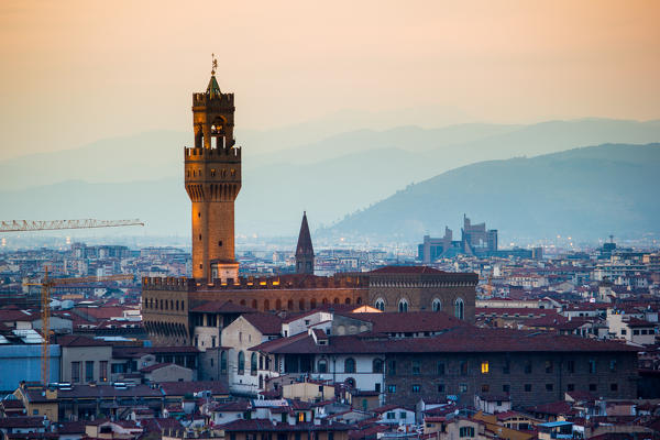 Florence, Tuscany, Italy. cityscape and Cathedral and Brunelleschi Dome, Giotto Tower. Sunset, lights on.