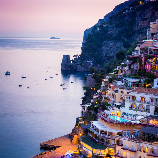 Positano, Amalfi Coast, Campania, Sorrento, Italy. View of the town and the seaside in a summer sunset