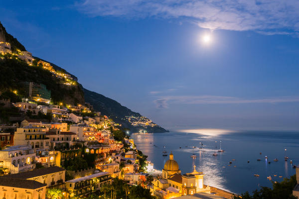 Positano, Amalfi Coast, Campania, Sorrento, Italy. View of the town and the seaside in a summer sunset