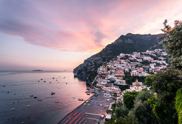 Positano, Amalfi Coast, Campania, Sorrento, Italy. View of the town and the seaside in a summer sunset