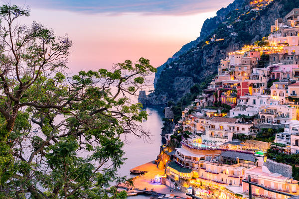 Positano, Amalfi Coast, Campania, Sorrento, Italy. View of the town and the seaside in a summer sunset
