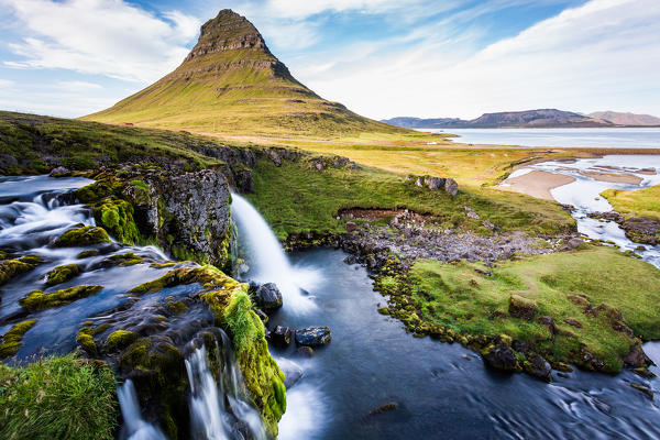 Kirkjufell Mountain, Snaefellsnes peninsula, Iceland. Landscape with waterfalls, long exposure in a sunny day