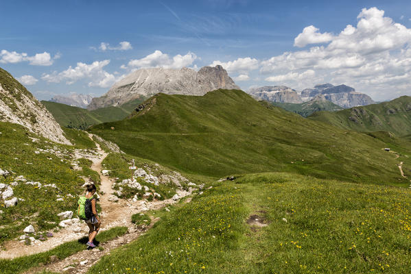 Italy, Trentino Alto Adige, Val di Fassa, Hiker on his way to the Dona Val from the Antermoia refuge.