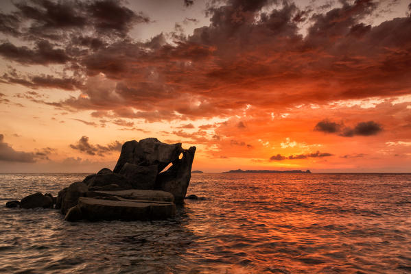 italy, Sardinia, Villasimius, dawn on reefs of Punta Molenti beach.