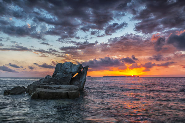 italy, Sardinia, Villasimius, dawn on reefs of Punta Molenti beach.