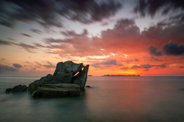 italy, Sardinia, Villasimius, dawn on reefs of Punta Molenti beach.