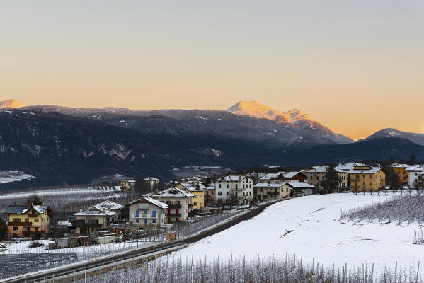 Italy;Trentino Alto Adige;Non valley, sunrise on Romeno Village and Luco Mount in a winter day.