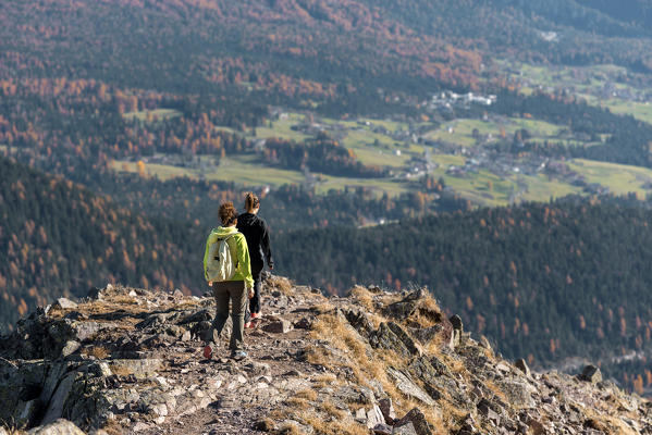 Italy, Trentino Alto Adige, Non valley, two women hikers descend from the top of Luco Mount.