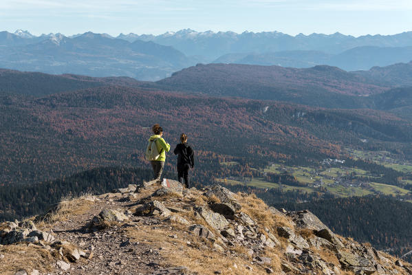 Italy, Trentino Alto Adige, Non valley, two women hikers descend from the top of Luco Mount.