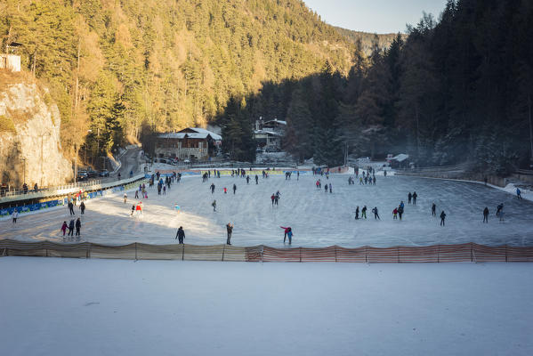 Skating at Smeraldo Lake, Fondo, Non Valley, Trentino Alto Adige, Italy.