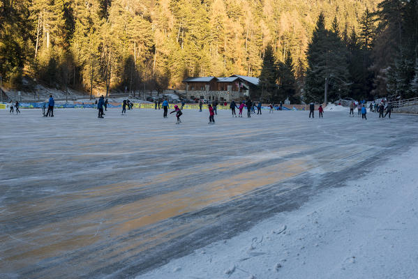Skating at Smeraldo Lake, Fondo, Non Valley, Trentino Alto Adige, Italy.