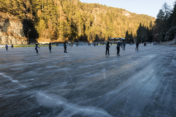 Skating at Smeraldo Lake, Fondo, Non Valley, Trentino Alto Adige, Italy.