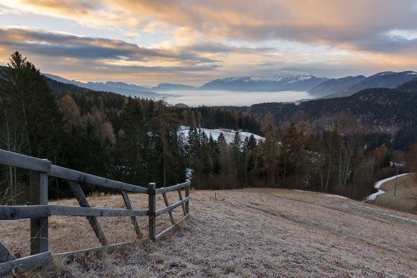 sunrise on the Non valley covered by fog, Trentino Alto Adige, Italy.