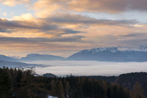 sunrise on the Non valley covered by fog, Trentino Alto Adige, Italy.