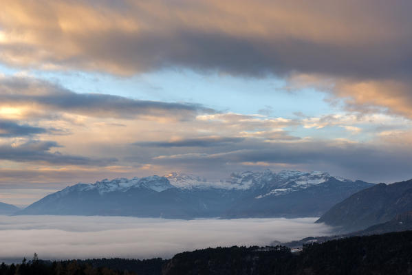 sunrise on the Non valley covered by fog, Trentino Alto Adige, Italy.