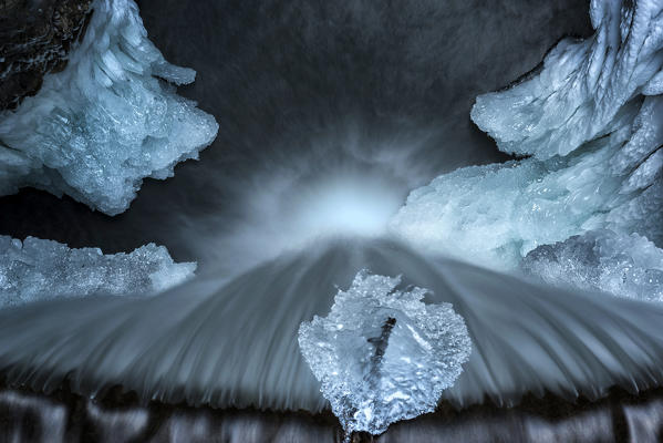Aereal view from frozen waterfall from Smeraldo lake, Non Valley, Trentino Alto Adige, Italy.