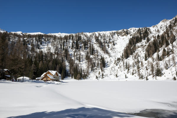 Italy, Trentino Alto Adige, Madonna di campiglio, natural park Adamello Brenta, Nambino refuge in a winter day.