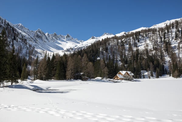 Italy, Trentino Alto Adige, Madonna di campiglio, natural park Adamello Brenta, Nambino refuge in a winter day.