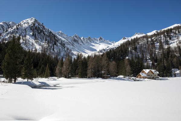 Italy, Trentino Alto Adige, Madonna di campiglio, natural park Adamello Brenta, Nambino refuge in a winter day.