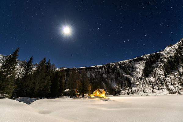 Italy, Trentino Alto Adige, starry night over Nambino refuge in natural park Adamello Brenta.