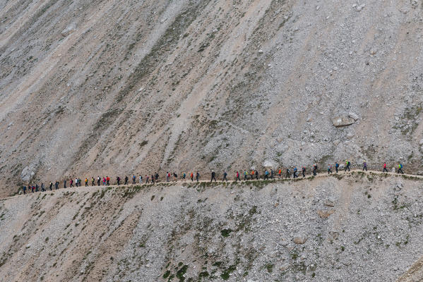 Europe, Italy, Dolomites, Tre Cime di Lavaredo. Hikers group venturing to discover the Locatelli refuge.