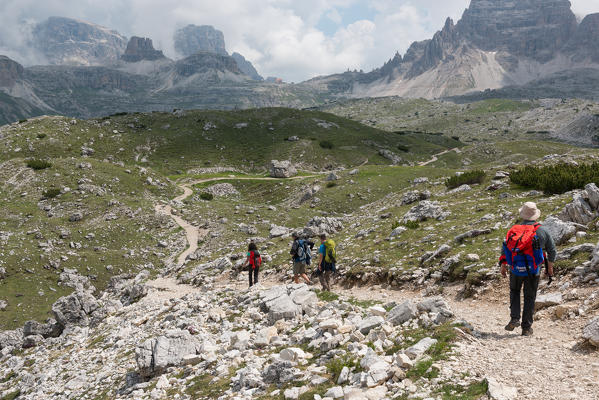 Europe, Italy, Dolomites, Belluno,Bolzano. Tre Cime di Lavaredo. Hikers venturing to discover the Locatelli refuge.