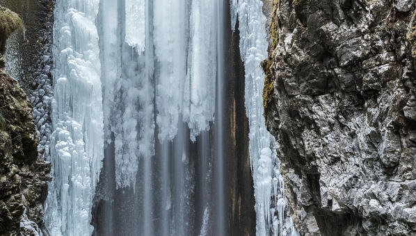 Italy, trentino south Tyrol, Non Valley, Waterfall from Smeraldo lake in winter.