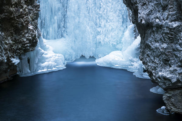 Italy, trentino south Tyrol, Non Valley, Waterfall from Smeraldo lake in winter.