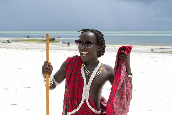 East Africa, Tanzania, Zanzibar, Masai has fun on kiwengwa beach.