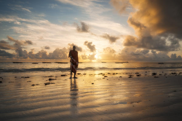 East Africa, Tanzania, Zanzibar, sunrise on Kiwengwa beach with a masai.