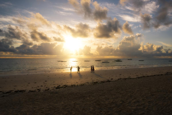 East Africa, Tanzania, Zanzibar, sunrise on Kiwengwa beach with a masai group.