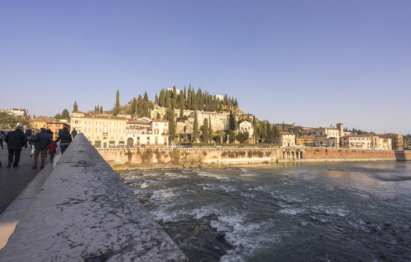 Verona, Veneto, Italy. Ponte Pietra, the Castello San Pietro on the background