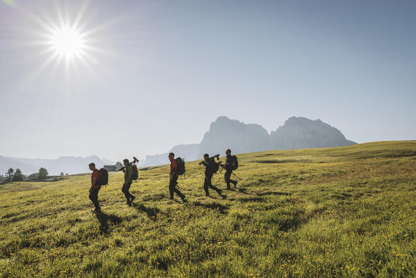 Alpe di Siusi/Seiser Alm, Dolomites, South Tyrol, Italy. Hikers on the Alpe di Siusi