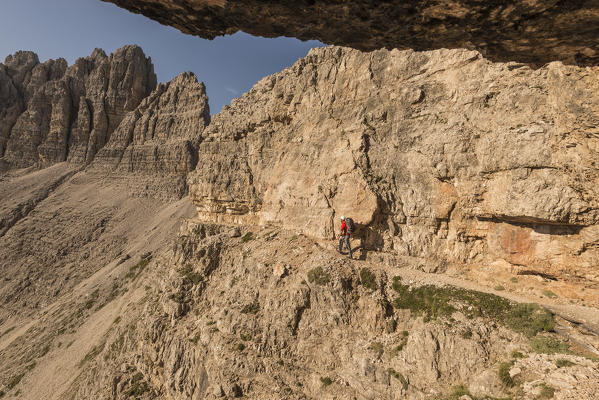 Sesto/Sexten, Dolomites, South Tyrol, province of Bolzano, Italy. An hiker walk on a First World War path near Forcella Passaporto