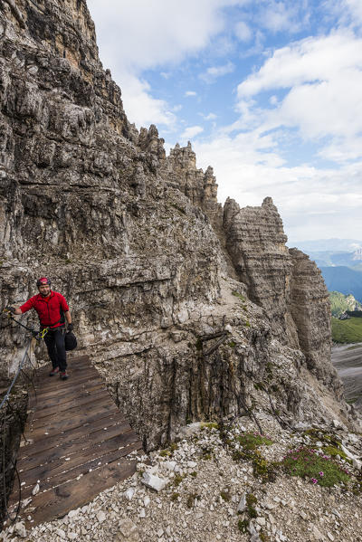 Sesto/Sexten, Dolomites, South Tyrol, province of Bolzano, Italy. Climber on the via ferrata 