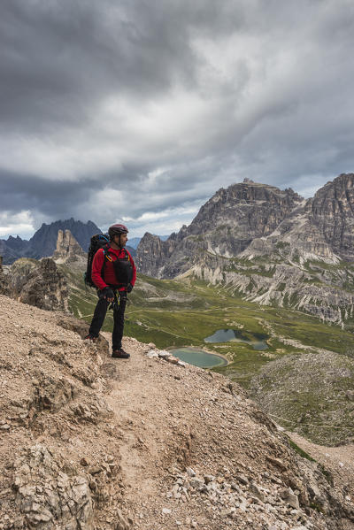 Sesto/Sexten, Dolomites, South Tyrol, province of Bolzano, Italy. Climber on the via ferrata 
