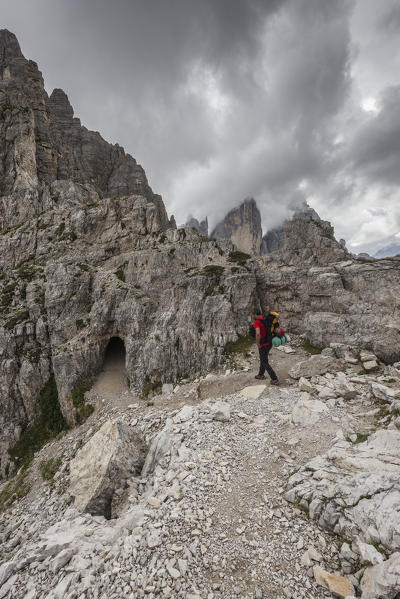 Sesto/Sexten, Dolomites, South Tyrol, province of Bolzano, Italy. Climber on the via ferrata 